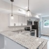 a kitchen with a granite countertop