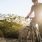 a man riding a bicycle on a hillside