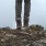 a person standing on a hilltop