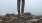 a person standing on a hilltop