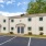 a building with a parking lot in front