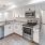 a kitchen with white cabinets