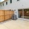 the back of a building with wooden fence